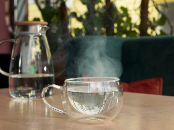 What are the proven benefits of drinking warm water in the morning?